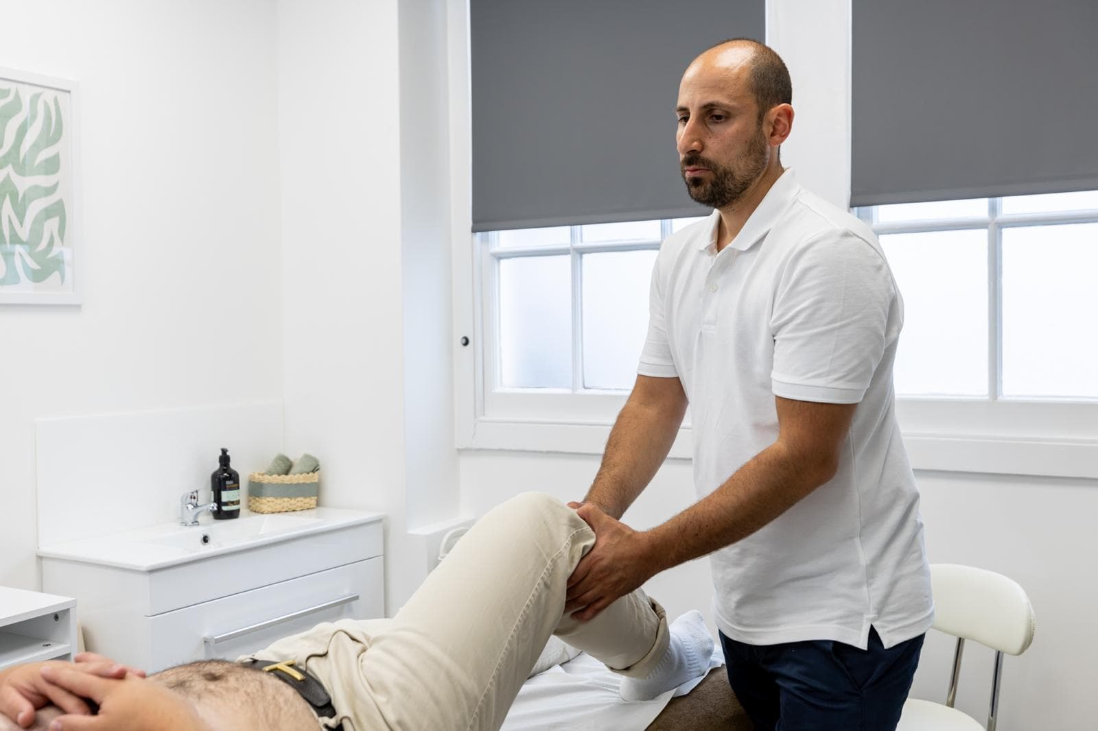 Abdul Abu-Laban treating a patient at Aberdeen Osteopathy & Massage Clinic