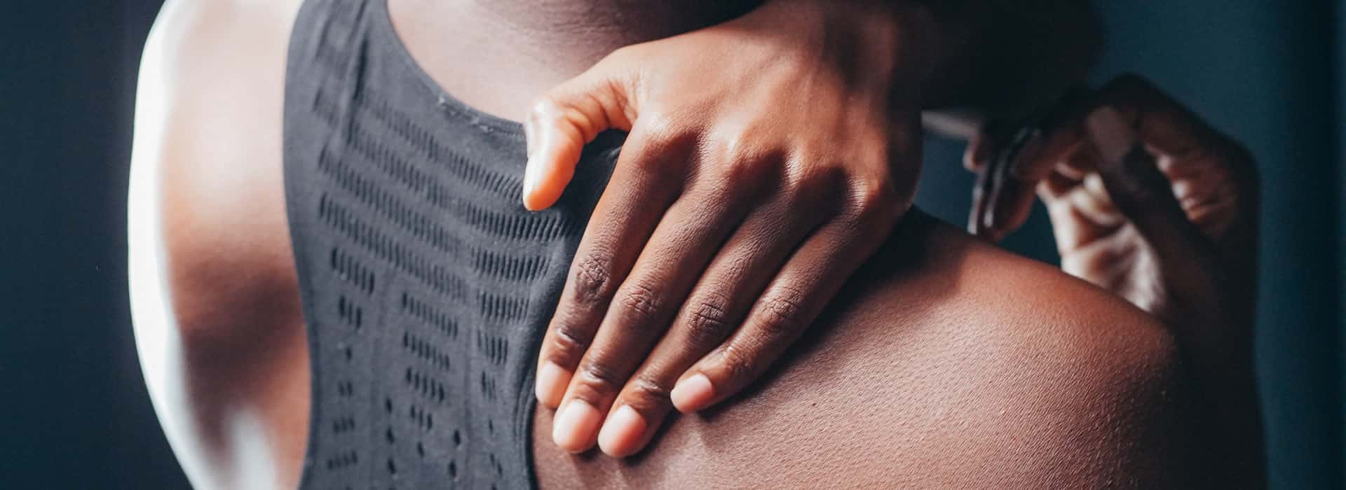 Athlete holding their shoulder after a minor sports injury